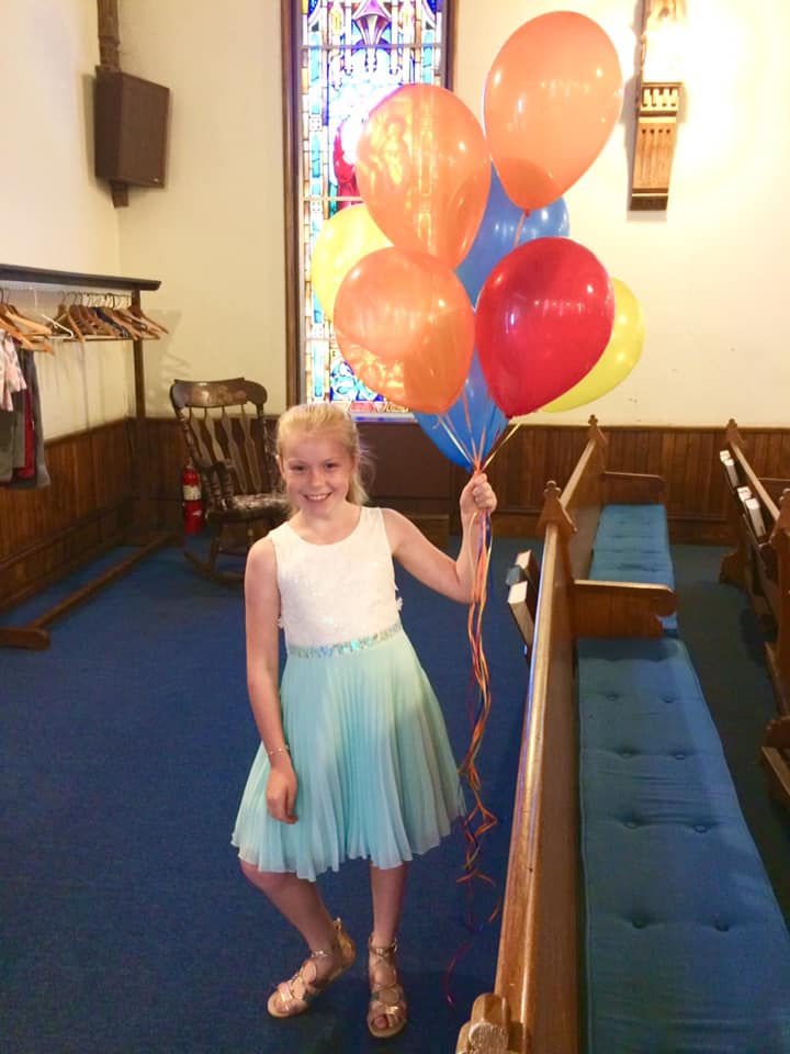 Welcoming the congregation with balloons!